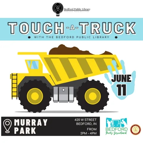 A yellow dump truck vehicle with a blue hand print on the tail