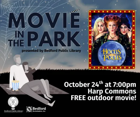 A cartoon couple sitting on a blanket with a bucket of popcorn pointing up to the movie poster showing Hocus Pocus